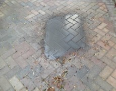 Driveway during oil stain removal