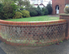 garden wall before pressure washing
